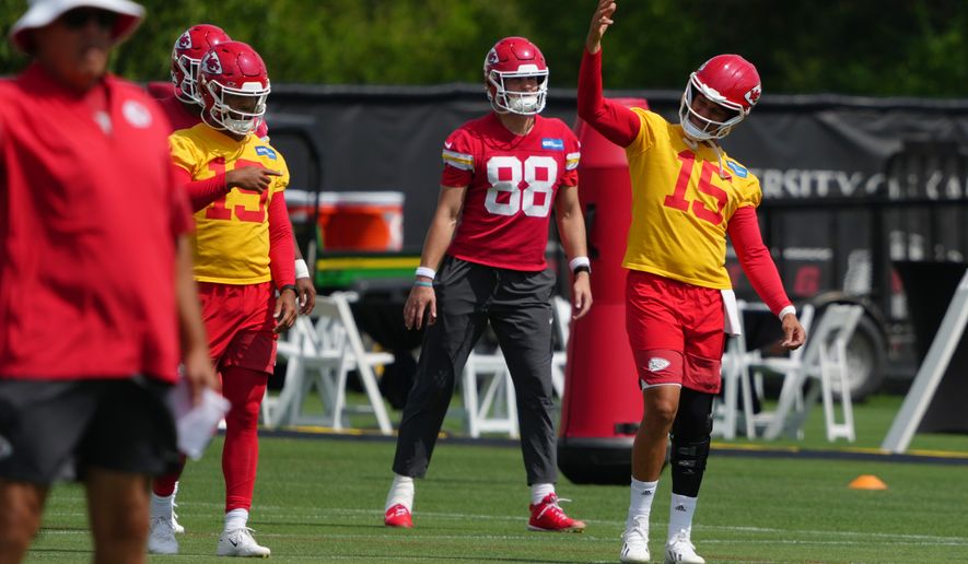 Kansas City Chiefs quarterback Patrick Mahomes (15) signals teammates during the NFL football team's practice Wednesday, June 10, 2026, in Kansas City, Mo. (AP Photo/Ed Zurga)