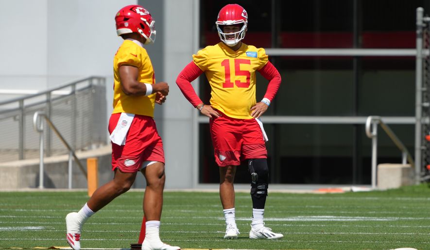 Kansas City Chiefs quarterback Patrick Mahomes (15) watches drills during the NFL football team's practice Tuesday, June 9, 2026, in Kansas City, Mo. (AP Photo/Ed Zurga)