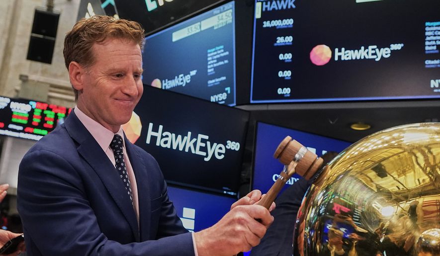 HawkEye 360 CEO John Serafini rings a ceremonial bell on the floor of the New York Stock Exchange as his company's IPO begins trading, Thursday, May 7, 2026. (AP Photo/Richard Drew)