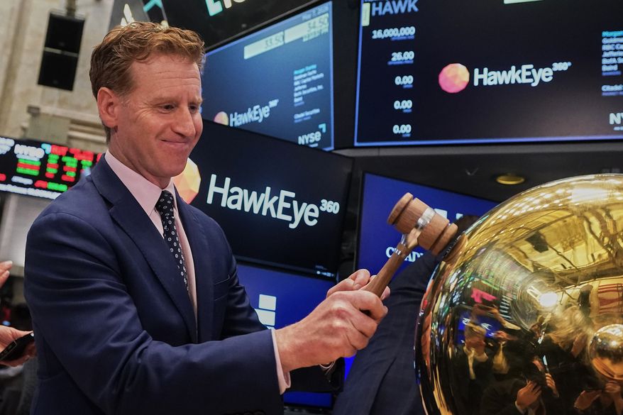 HawkEye 360 CEO John Serafini rings a ceremonial bell on the floor of the New York Stock Exchange as his company's IPO begins trading, Thursday, May 7, 2026. (AP Photo/Richard Drew)