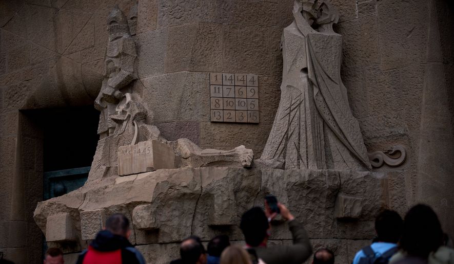 A detail of the Passion Façade shows the basilica's famous magic square at the Sagrada Família in Barcelona, Spain, May 15, 2026. Unlike a sudoku, every row, column and diagonal adds up to 33, symbolizing the age of Christ at his death.(AP Photo/Emilio Morenatti)