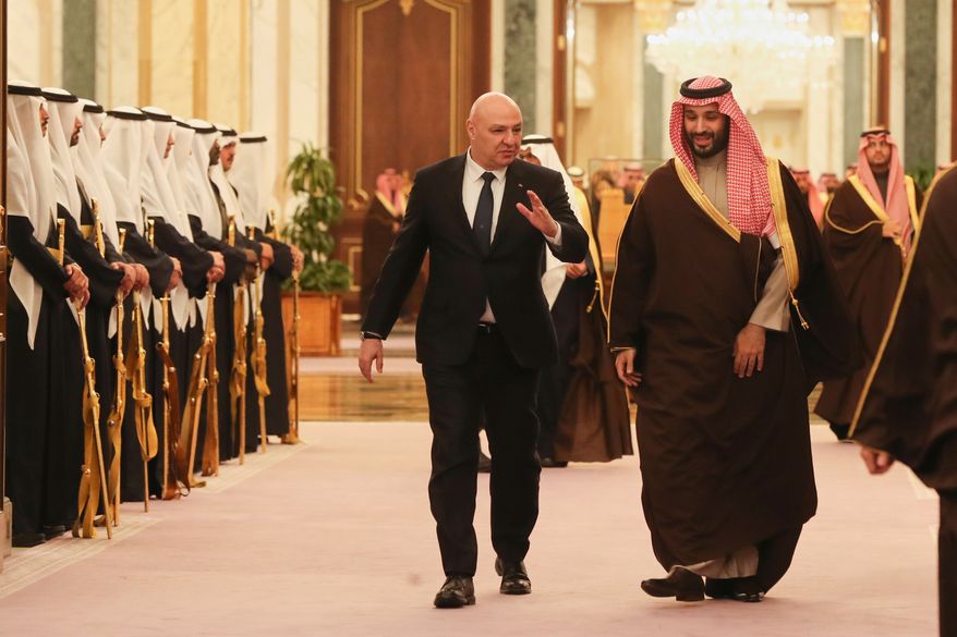 In this photo released by the Lebanese Presidency press office, Saudi Crown Prince Mohammed bin Salman accompanies Lebanese President Joseph Aoun, left, upon his arrival to the Royal Palace in Riyadh, Saudi Arabia, March 3, 2025. (Lebanese Presidency press office via AP, File)
