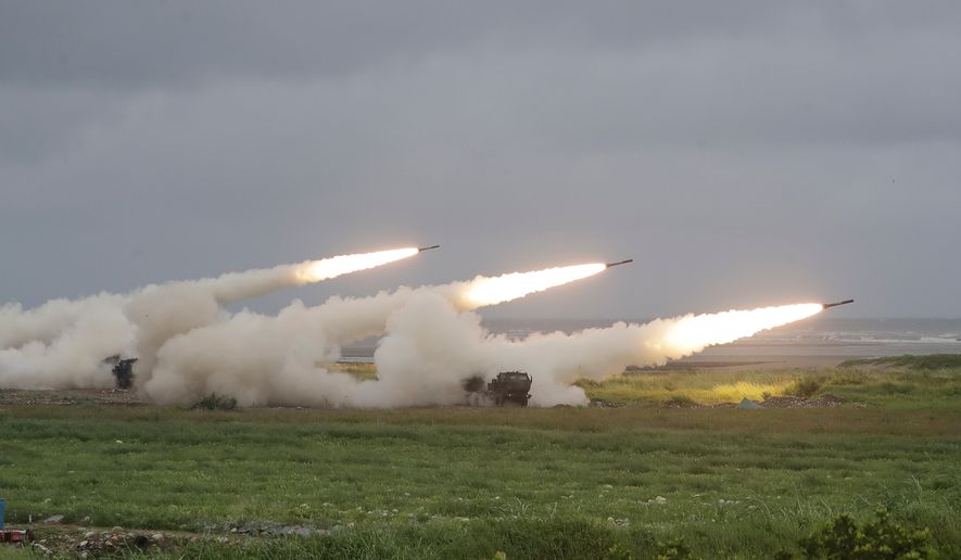 Rockets are launched from High Mobility Artillery Rocket System (HIMARS) during a military live-fire shooting training in Taichung City, Taiwan, Wednesday, June 10, 2026. (AP Photo/Chiang Ying-ying)