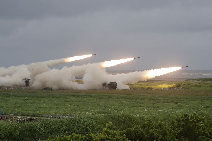 Rockets are launched from High Mobility Artillery Rocket System (HIMARS) during a military live-fire shooting training in Taichung City, Taiwan, Wednesday, June 10, 2026. (AP Photo/Chiang Ying-ying)