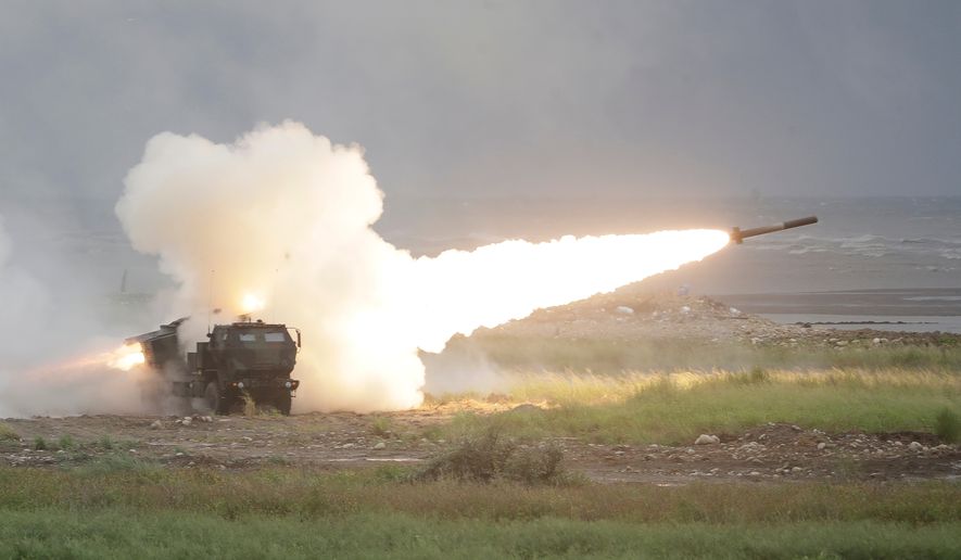 A rocket is launched from a High Mobility Artillery Rocket System (HIMARS) during a military live-fire shooting training in Taichung City, Taiwan, Wednesday, June 10, 2026. (AP Photo/Chiang Ying-ying)
