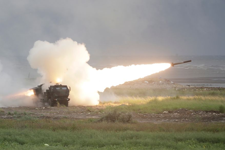 A rocket is launched from a High Mobility Artillery Rocket System (HIMARS) during a military live-fire shooting training in Taichung City, Taiwan, Wednesday, June 10, 2026. (AP Photo/Chiang Ying-ying)