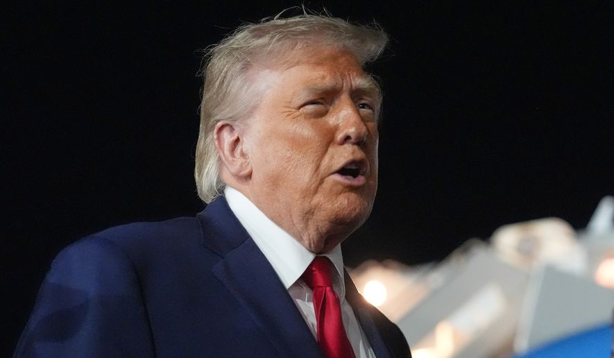 President Donald Trump talks with reporters before boarding Air Force One at John F. Kennedy International Airport in New York, early Tuesday, June 9, 2026. (AP Photo/Mark Schiefelbein) ** FILE **
