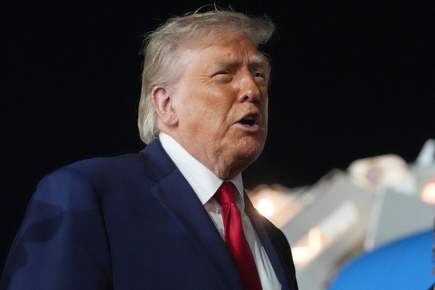 President Donald Trump talks with reporters before boarding Air Force One at John F. Kennedy International Airport in New York, early Tuesday, June 9, 2026. (AP Photo/Mark Schiefelbein) ** FILE **