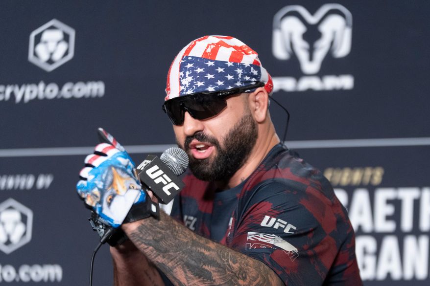 UFC heavyweight fighter Josh Hokit speaks to reporters during the UFC Freedom 250 media day, Wednesday, June 10, 2026, in Washington. (AP Photo/Manuel Balce Ceneta)