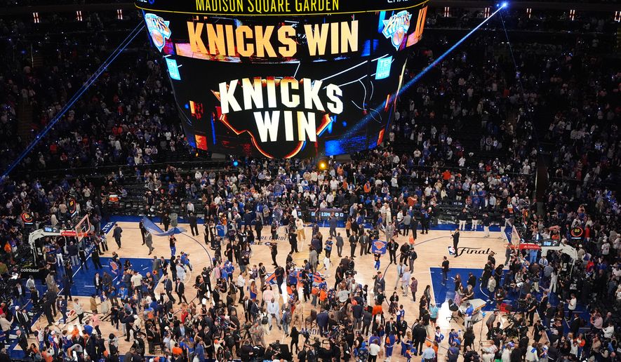 Players and fans celebrate after the New York Knicks' victory over the San Antonio Spurs in Game 4 of the NBA Finals basketball series, Wednesday, June 10, 2026, in New York. (AP Photo/Frank Franklin II)