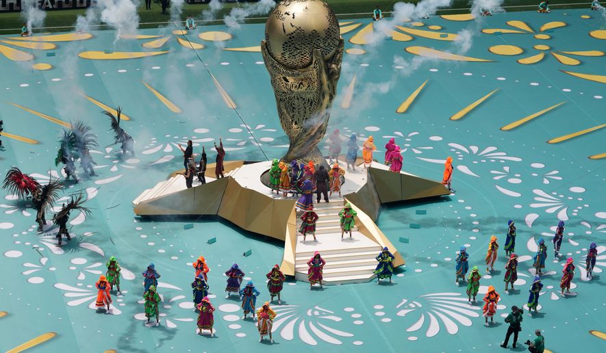 Colombian singer J Balvin, center on stairs, performs before the start of the World Cup Group A soccer match between Mexico and South Africa in Mexico City, Thursday, June 11, 2026. (AP Photo/Ricardo Mazalan)