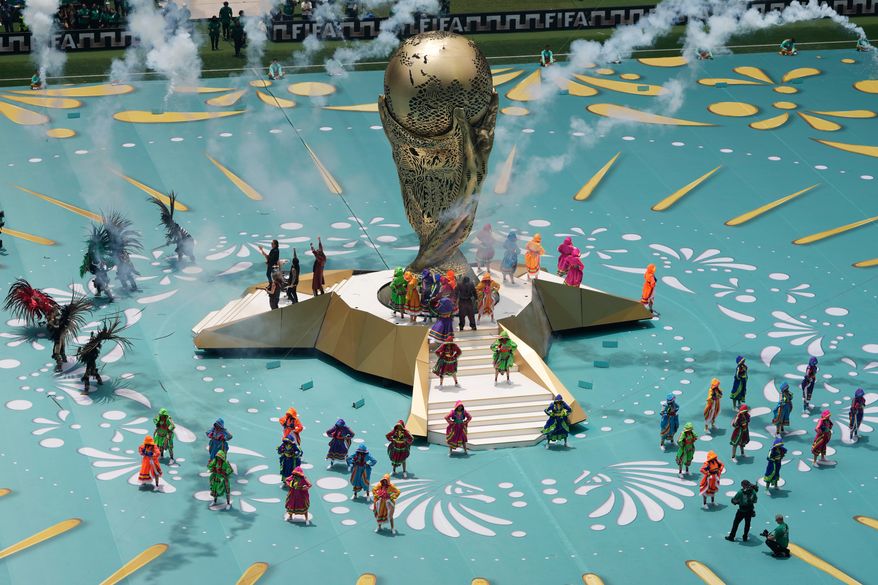 Colombian singer J Balvin, center on stairs, performs before the start of the World Cup Group A soccer match between Mexico and South Africa in Mexico City, Thursday, June 11, 2026. (AP Photo/Ricardo Mazalan)