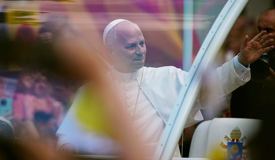 Pope Leo XIV waves as he arrives to celebrate Mass at the Basilica of the Sagrada Familia in Barcelona, Spain, Wednesday, June 10, 2026. (AP Photo/Joan Mateu Parra)