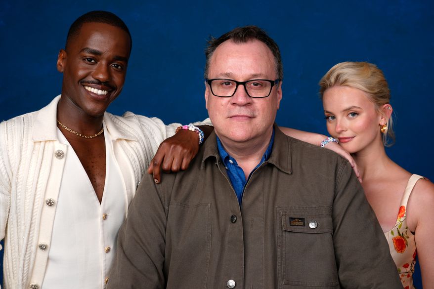 Ncuti Gatwa, from left, Russell T Davies, and Millie Gibson pose for a portrait to promote "Doctor Who" during Comic-Con International on July 26, 2024, in San Diego. (AP Photo/Chris Pizzello, File)
