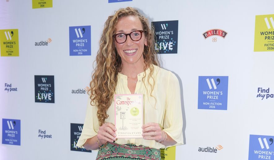 Virginia Evans holding her book The Correspondent, poses for a photograph at the 2026 Women's Prize Trust Summer Party & Awards Ceremony in London, Thursday, June 11, 2026. (AP Photo/Kin Cheung)