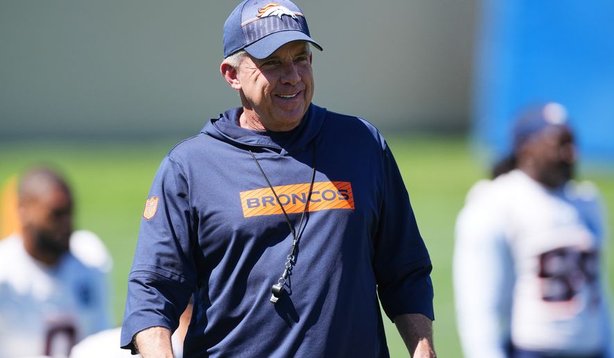Denver Broncos head coach Sean Payton looks on as players warm up during an NFL football practice at the team's headquarters Thursday, June 4, 2026, in Centennial, Colo. (AP Photo/David Zalubowski)