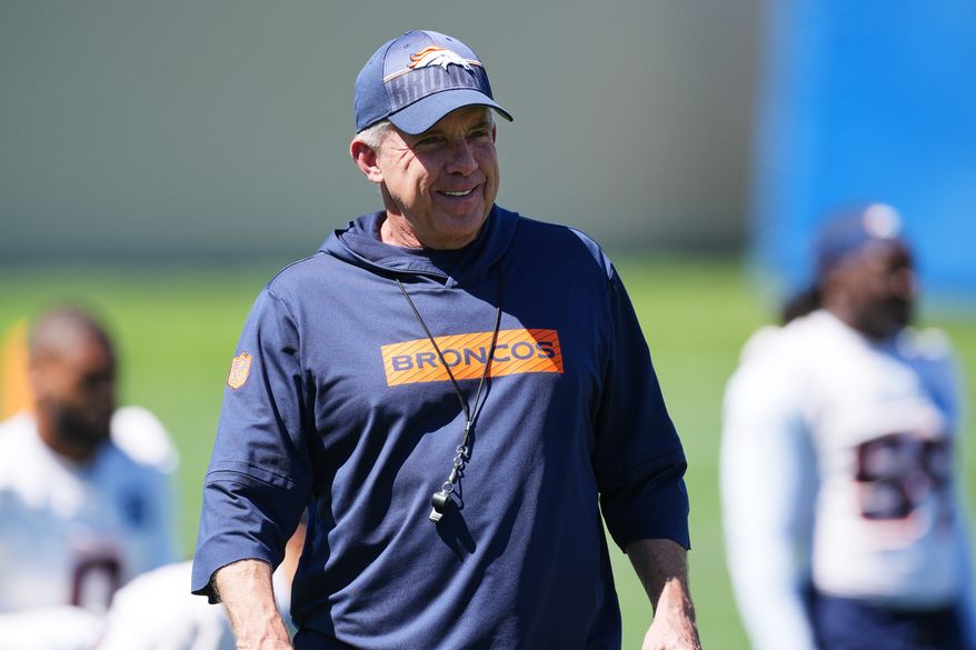 Denver Broncos head coach Sean Payton looks on as players warm up during an NFL football practice at the team's headquarters Thursday, June 4, 2026, in Centennial, Colo. (AP Photo/David Zalubowski)