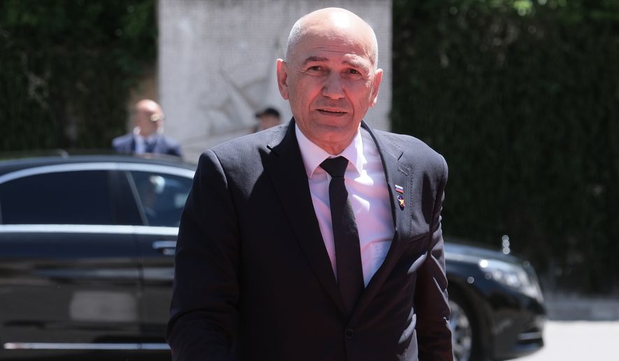Slovenia's Prime Minister Janez Jansa arrives to attend the EU-Western Balkans summit in Tivat, Montenegro, Friday, June 5, 2026. (AP Photo/Risto Bozovic)