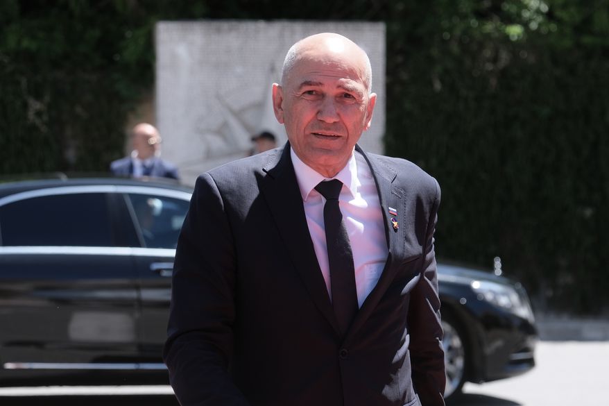Slovenia's Prime Minister Janez Jansa arrives to attend the EU-Western Balkans summit in Tivat, Montenegro, Friday, June 5, 2026. (AP Photo/Risto Bozovic)