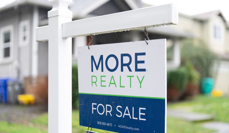 FILE - A "For Sale" sign is seen on Tuesday, Jan. 6, 2026, in Portland, Ore. (AP Photo/Jenny Kane, File)