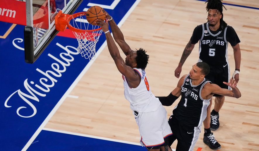 New York Knicks forward Og Anunoby (8) shoots during Game 3 of the NBA Finals basketball series against the San Antonio Spurs, Monday, June 8, 2026, in New York. (AP Photo/Yuki Iwamura)