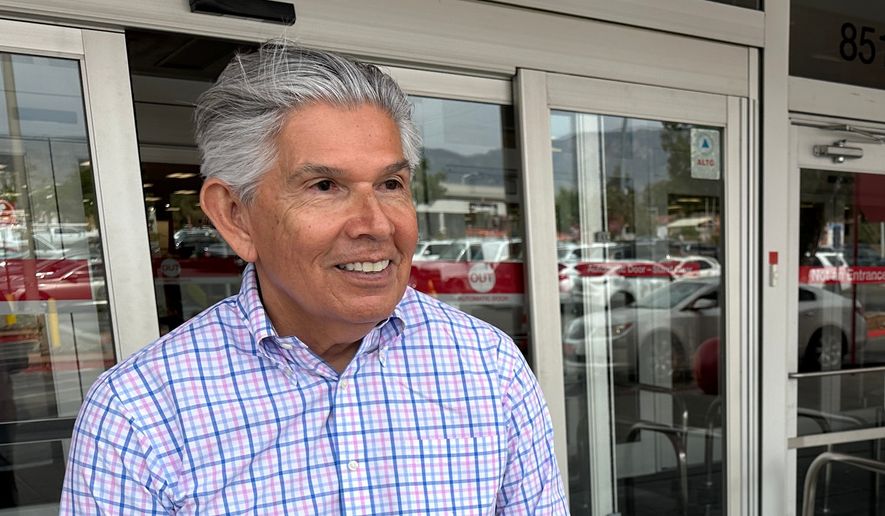 FILE - Republican gubernatorial candidate Duke Rodriguez talks with a voter in Albuquerque, N.M., Tuesday, June 2, 2026. (AP Photo/Susan Montoya Bryan, File)