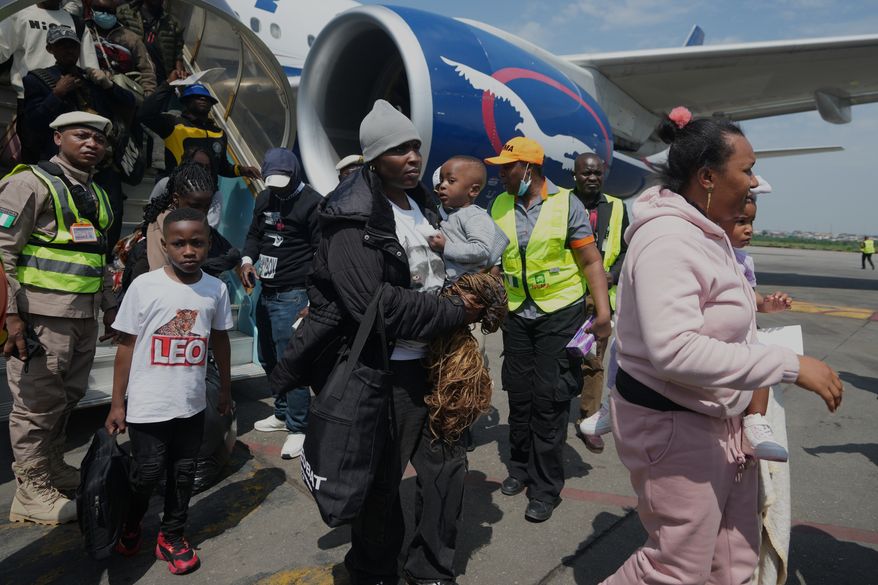 Nigerian nationals repatriated from South Africa arrive at the Murtala Muhammed International Airport in Lagos, Nigeria, Thursday, June 11, 2026. (AP Photo/Sunday Alamba)