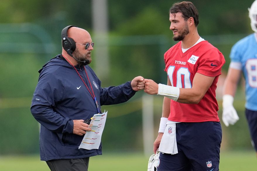 Tennessee Titans offensive coordinator Brian Daboll greets quarterback Mitch Trubisky (10) during an NFL football practice Monday, June 8, 2026, in Nashville, Tenn. (AP Photo/George Walker IV)