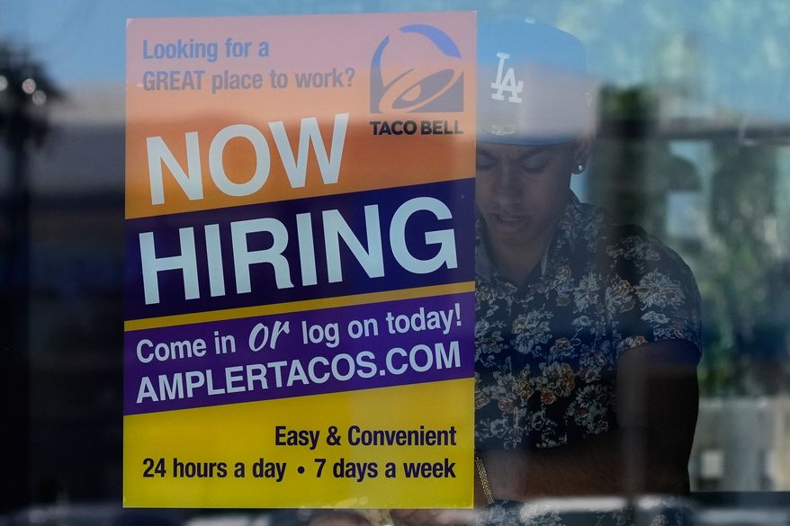 A hiring sign is displayed at a restaurant in Niles, Ill., Thursday, May 14, 2026. (AP Photo/Nam Y. Huh, File)