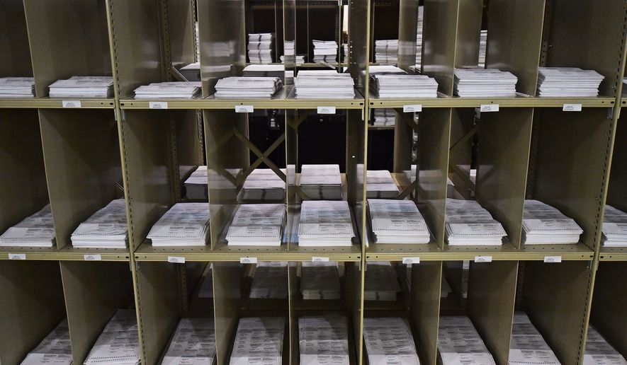 Mail-in ballots sit on shelves inside the Trumbull County Board of Elections in Warren, Ohio, on Nov. 3, 2020. (AP Photo/David Dermer) **FILE**