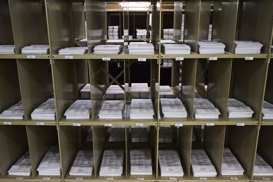 Mail-in ballots sit on shelves inside the Trumbull County Board of Elections in Warren, Ohio, on Nov. 3, 2020. (AP Photo/David Dermer) **FILE**