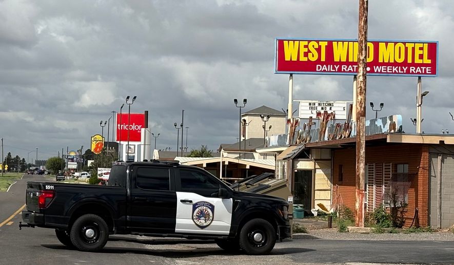 Law enforcement responds to an active shooting scene Friday, June 12, 2026, in Midland, Texas. (Luke Dias/Reporter-Telegram via AP)