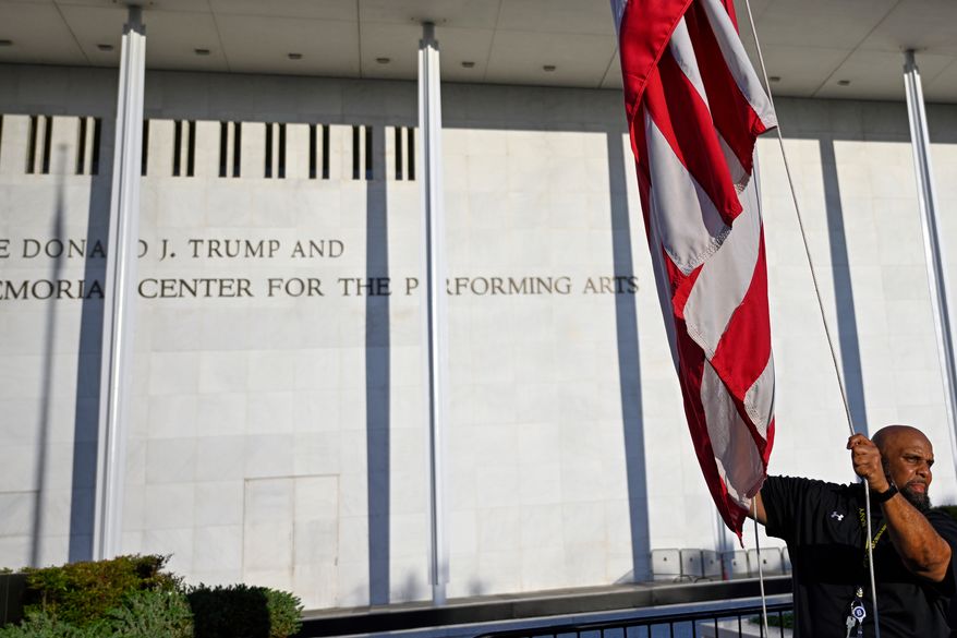 The American flag is raised in front of The John F. Kennedy Center for the Performing Arts, Friday, June 12, 2026, in Washington. (AP Photo/John McDonnell