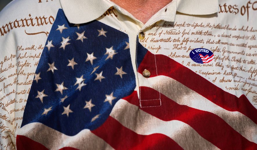 A man wears an "I voted" sticker on his shirt, printed with the American flag and the U.S. Constitution, after voting at Wa-Ke Hatchee Recreation Center in Fort Myers, Fla, on Election Day, Nov. 8, 2022. (AP Photo/Rebecca Blackwell, File)