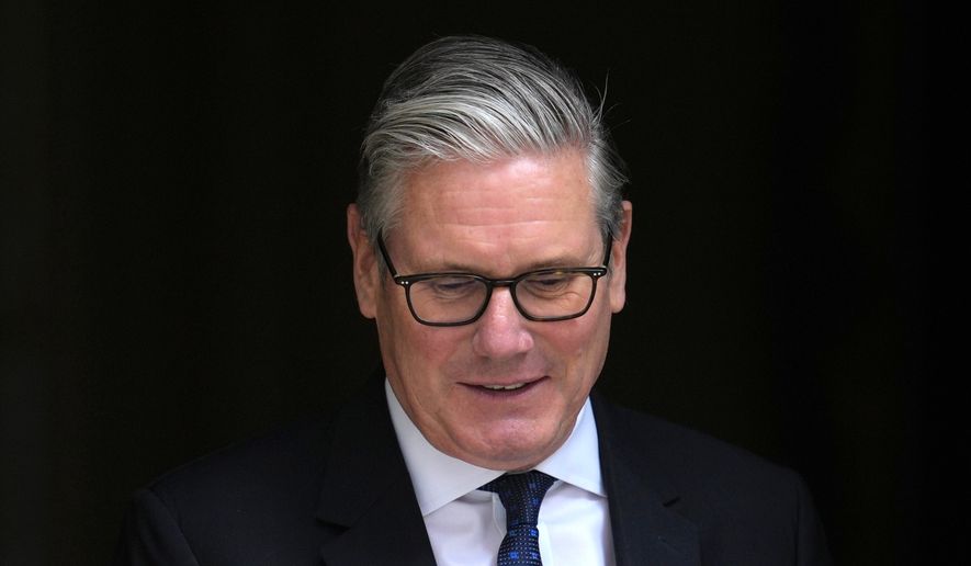 Britain's Prime Minister Keir Starmer leaves 10 Downing Street to attend the weekly session of Prime Minister's Questions in parliament in London, Wednesday, June 10, 2026. (AP Photo/Kin Cheung)
