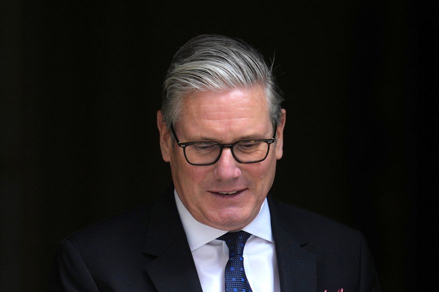 Britain's Prime Minister Keir Starmer leaves 10 Downing Street to attend the weekly session of Prime Minister's Questions in parliament in London, Wednesday, June 10, 2026. (AP Photo/Kin Cheung)