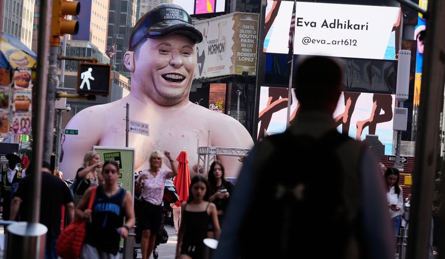 A large inflatable figure depicting Elon Musk stands in Times Square in New York on Thursday, June 11, 2026. (AP Photo/Seth Wenig)