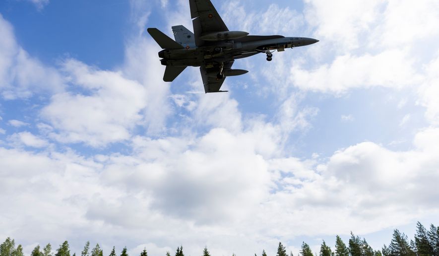 A F/A-18 Hornet multi-role fighter of the Finnish Air Force lands on a road strip during NATO's Ramstein Flag 26 exercise in Tervo, Finland, Wednesday June 10, 2026. (Matias Honkamaa/Lehtikuva via AP)