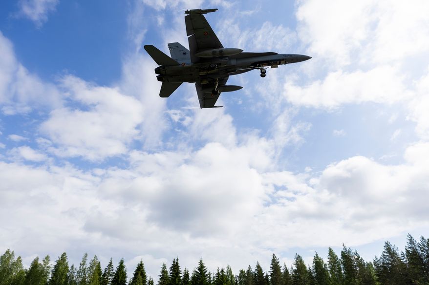 A F/A-18 Hornet multi-role fighter of the Finnish Air Force lands on a road strip during NATO's Ramstein Flag 26 exercise in Tervo, Finland, Wednesday June 10, 2026. (Matias Honkamaa/Lehtikuva via AP)