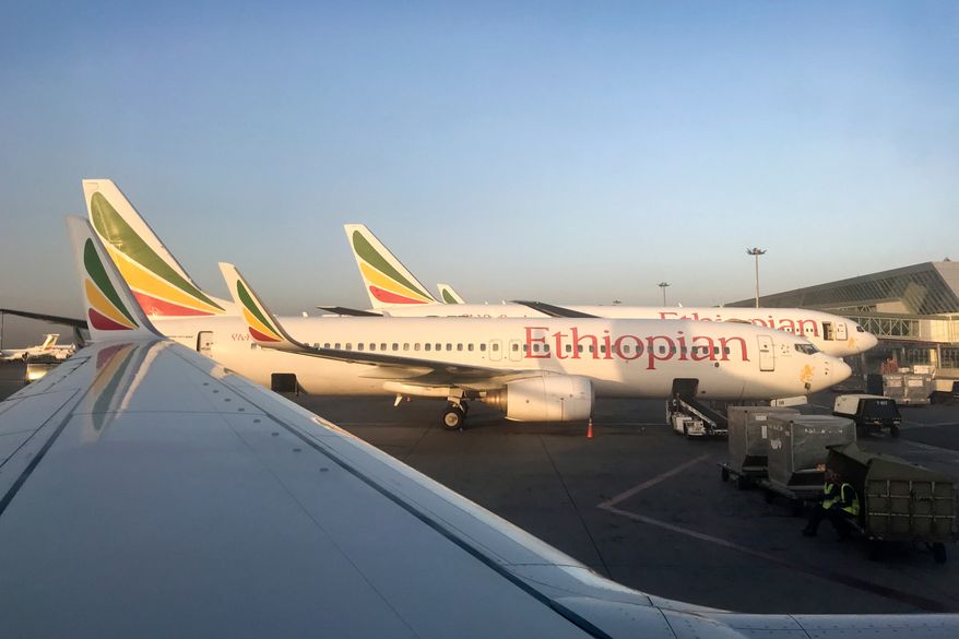 FILE - Ethiopian Airlines planes are parked at Bole International Airport in Addis Ababa, Ethiopia, Monday, Feb. 11, 2019. (AP Photo/Ben Curtis, File)
