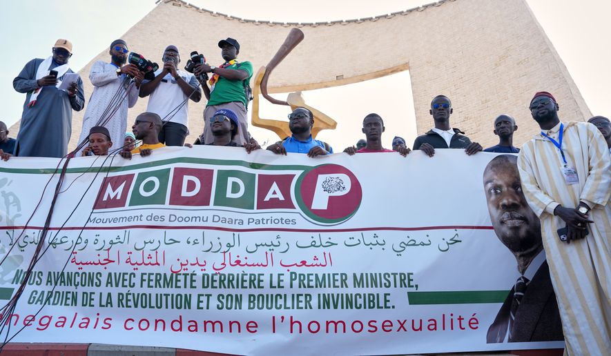 FILE - Protesters demonstrate against homosexuality in Dakar, Senegal, Friday, March 6, 2026. (AP Photo/Misper Apawu, file)