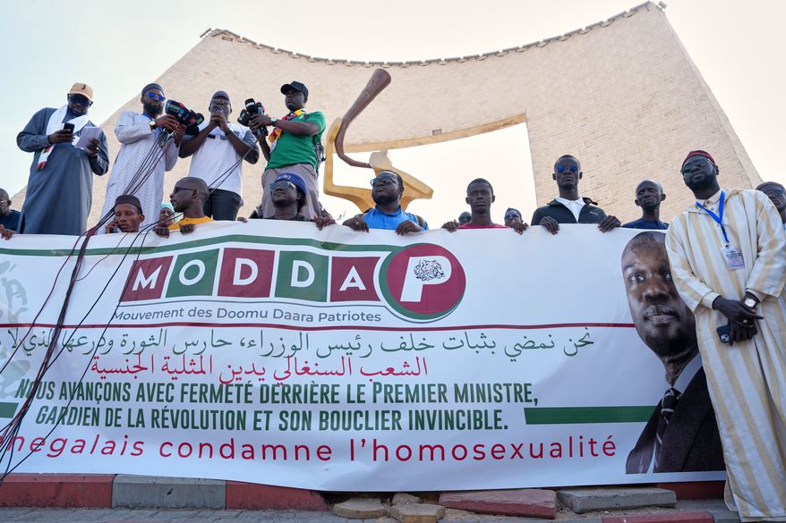 FILE - Protesters demonstrate against homosexuality in Dakar, Senegal, Friday, March 6, 2026. (AP Photo/Misper Apawu, file)