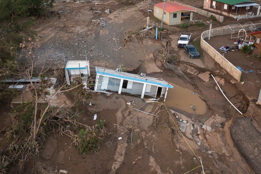 A house lays in the mud after it was washed away by Hurricane Fiona at Villa Esperanza in Salinas, Puerto Rico, Sept. 21, 2022. (AP Photo/Alejandro Granadillo)
