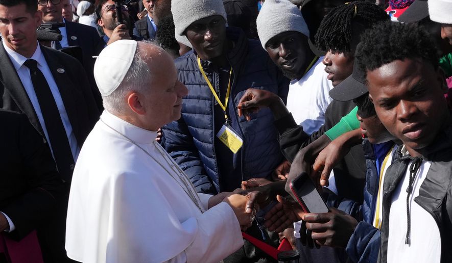 Pope Leo XIV meets migrants at the 'Las Raices' center, in San Cristobal de la Laguna, Tenerife, Spain, Friday, June 12, 2026. (AP Photo/Alessandra Tarantino)