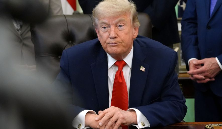 President Donald Trump listens during an event to sign a proclamation about the fishing industry, in the Oval Office of the White House, Thursday, June 11, 2026, in Washington. (AP Photo/Jacquelyn Martin)