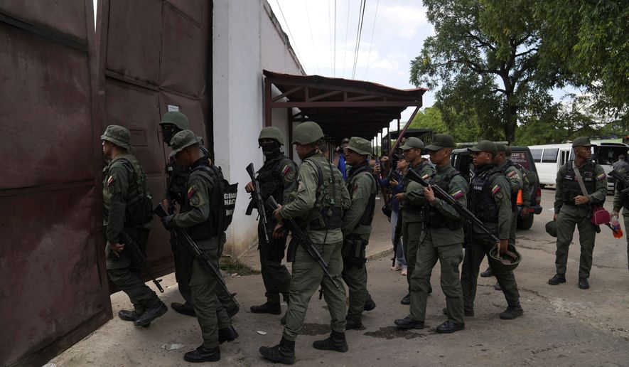 Soldiers raid the Tocorón Penitentiary Center, where the Tren de Aragua gang originated, in Tocorón, Venezuela, Sept. 20, 2023. (AP Photo/Ariana Cubillos, File)