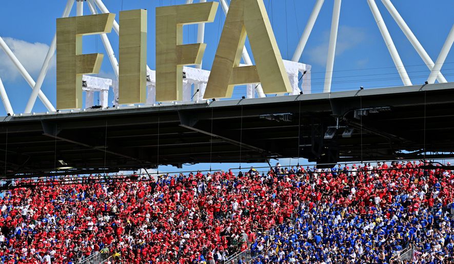Fans of both teams cheer under a FIFA sign in the stands during the World Cup Group B soccer match between Canada and Bosnia, Friday, June 12, 2026, in Toronto. (Sammy Kogan/The Canadian Press via AP)