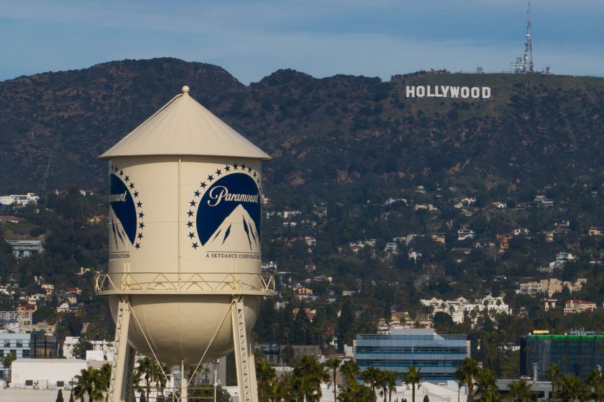 The Paramount Pictures water tower is seen in Los Angeles, Thursday, Dec. 18, 2025, with the Hollywood sign in the distance. (AP Photo/Jae C. Hong, File)