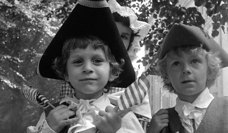 Five-year-old Thomas Scott of Bridgewater, Mass., celebrates the U.S. bicentennial in Boston's Fourth of July parade, Sunday, July 4, 1976. (AP Photo/File)