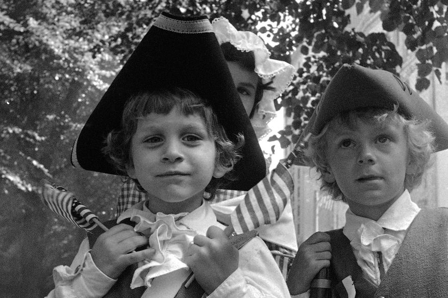 Five-year-old Thomas Scott of Bridgewater, Mass., celebrates the U.S. bicentennial in Boston's Fourth of July parade, Sunday, July 4, 1976. (AP Photo/File)